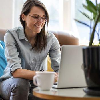 Person on laptop with coffee